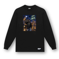 A black long-sleeve crewneck sweatshirt with a colorful graphic print on the chest depicting a street scene with a boombox and the text 'SUCIOS AK-47'. A small white 'SUCIOS' brand logo is printed on the bottom right hem.